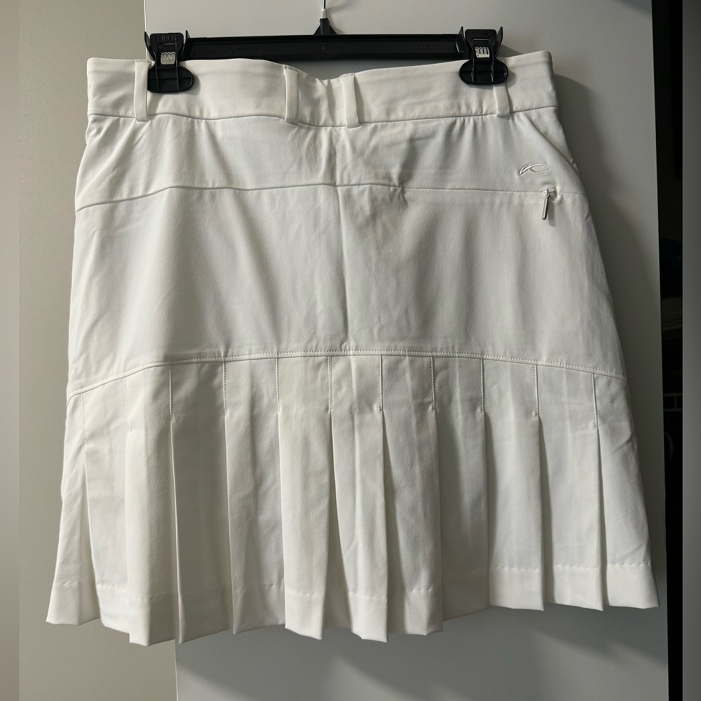 BRAND NEW, never worn Kjus golf skort. White. Size 38 EU (Medium)/ 6 or 8 US